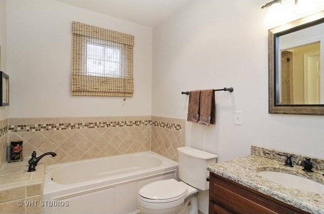 24270 N Forest Dr, Lake Zurich, IL 60047 - bathroom featuring toilet, a garden tub, and vanity