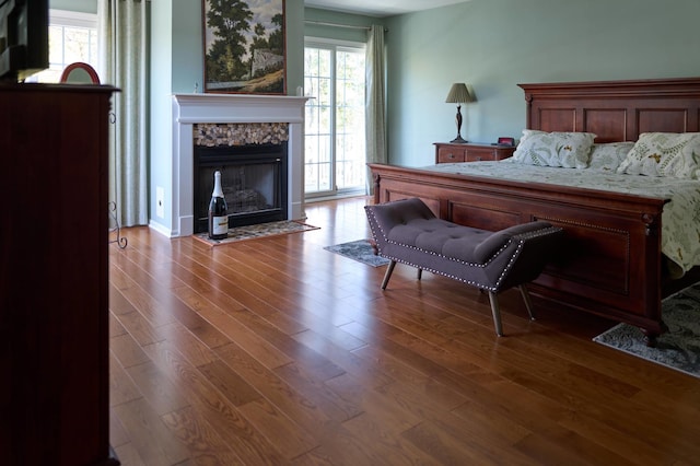 24270 N Forest Dr, Lake Zurich, IL 60047 - bedroom with wood finished floors and a fireplace