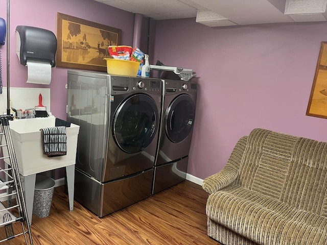 24270 N Forest Dr, Lake Zurich, IL 60047 - laundry area with washer and dryer, wood finished floors, and baseboards