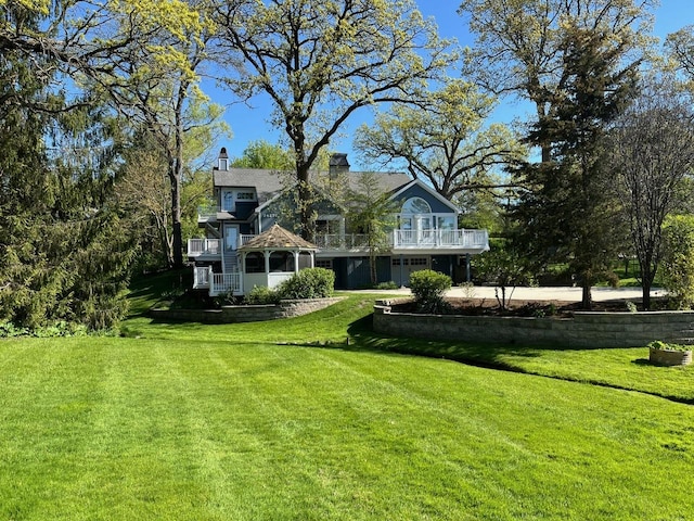 24270 N Forest Dr, Lake Zurich, IL 60047 - view of green lawn with a balcony and a garage