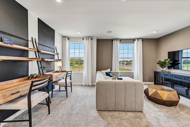 carpeted living area with a healthy amount of sunlight, baseboards, and recessed lighting