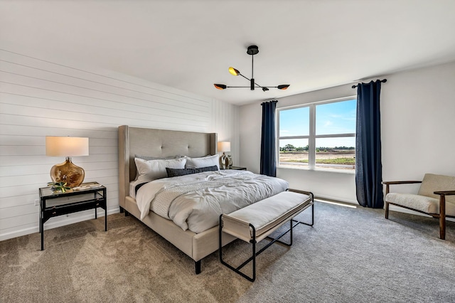 bedroom with carpet flooring and an inviting chandelier