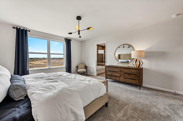 bedroom with carpet floors, connected bathroom, baseboards, and a notable chandelier