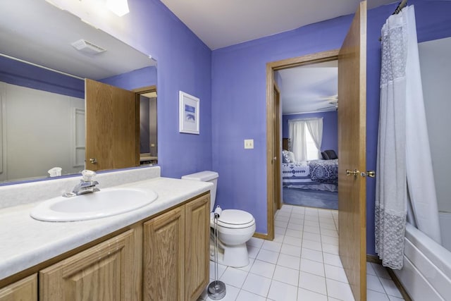 ensuite bathroom featuring visible vents, tile patterned floors, vanity, toilet, and ensuite bathroom