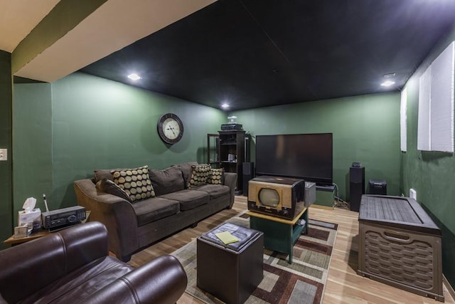 living area with recessed lighting and wood finished floors
