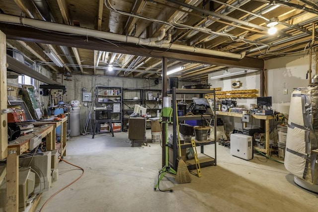 unfinished below grade area featuring a workshop area