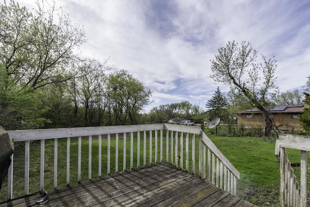 wooden deck with a lawn