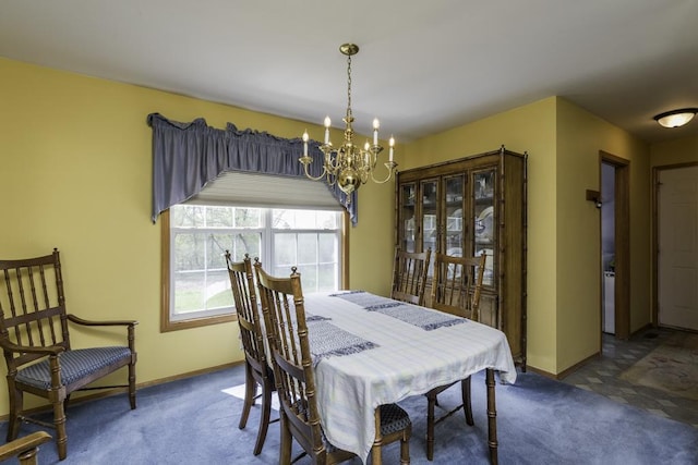 dining area featuring baseboards, an inviting chandelier, and carpet