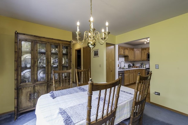 dining space with dark colored carpet, baseboards, and a notable chandelier