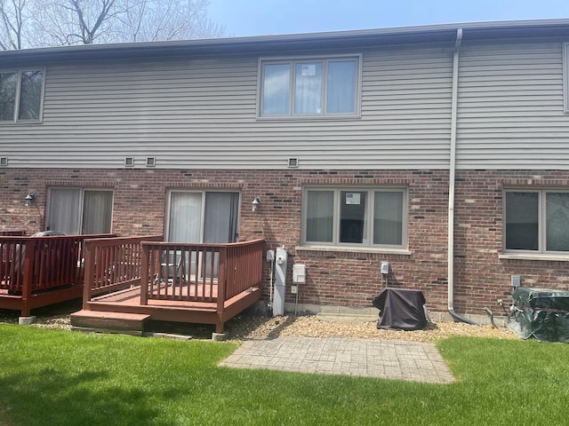 4305 W Termunde Dr, Alsip, IL 60803 - rear view of property featuring a lawn, brick siding, and a wooden deck