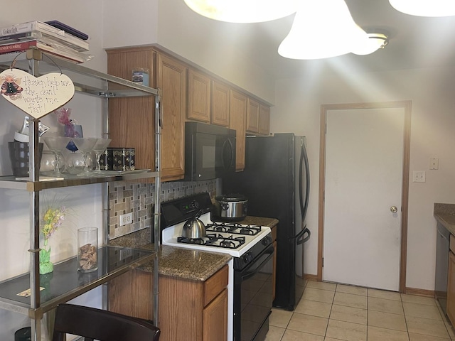 4305 W Termunde Dr, Alsip, IL 60803 - kitchen featuring ventilation hood, brown cabinets, backsplash, light tile patterned floors, and black appliances