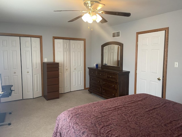 4305 W Termunde Dr, Alsip, IL 60803 - bedroom featuring visible vents, ceiling fan, two closets, and light carpet
