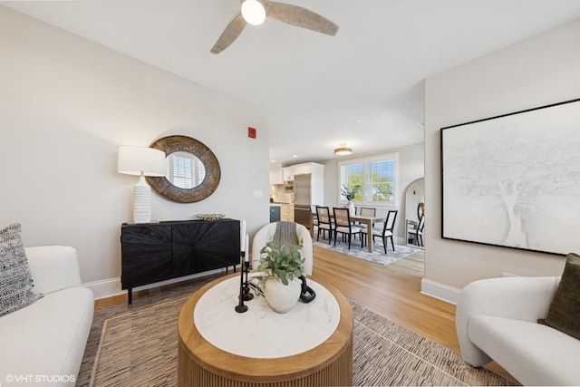 514 Hillgrove Ave Unit 303, Western Springs, IL 60558 - living area with baseboards, light wood finished floors, and a ceiling fan
