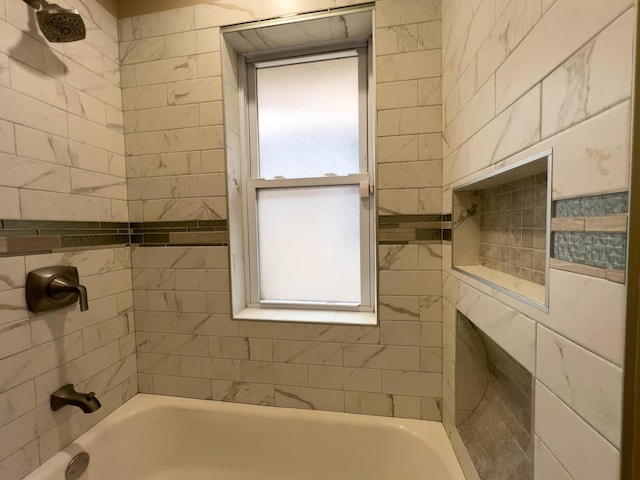 bathroom with plenty of natural light and shower / washtub combination