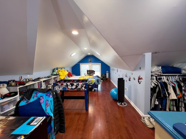 playroom with baseboards, vaulted ceiling, and wood finished floors