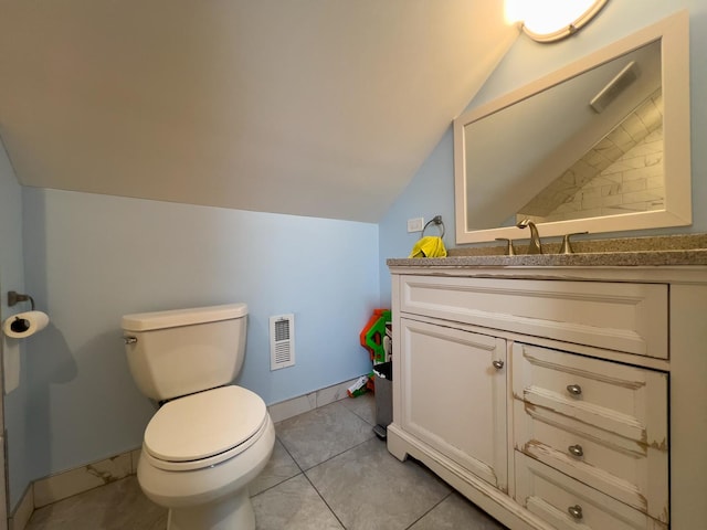 bathroom featuring toilet, visible vents, lofted ceiling, and vanity