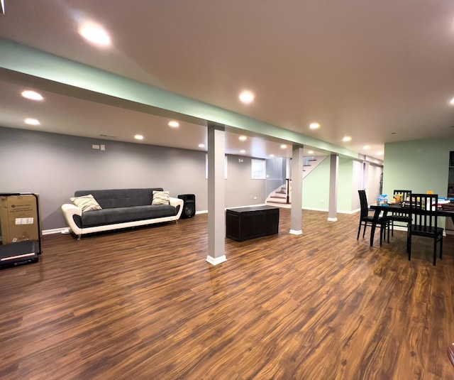 living room with recessed lighting, baseboards, dark wood-style floors, and stairs