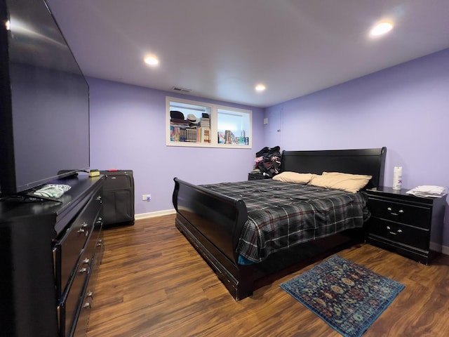bedroom with dark wood-style flooring, baseboards, recessed lighting, and visible vents