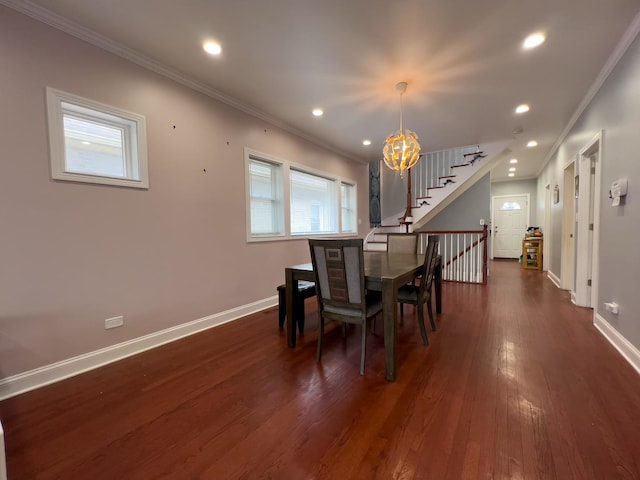 dining space featuring baseboards, ornamental molding, a notable chandelier, and dark wood-style floors