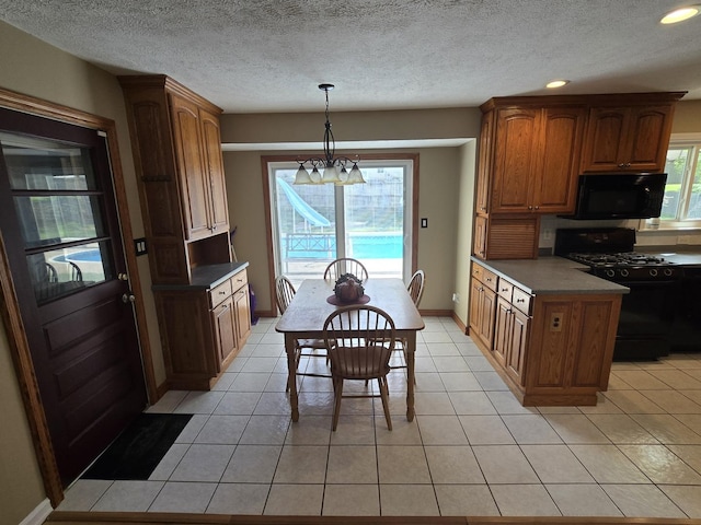 kitchen with pendant lighting, brown cabinets, black appliances, recessed lighting, and light tile patterned flooring