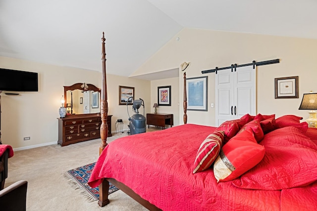 carpeted bedroom featuring baseboards, a barn door, and vaulted ceiling