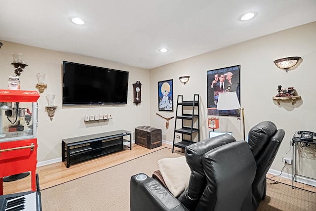 living area featuring recessed lighting, baseboards, and wood finished floors