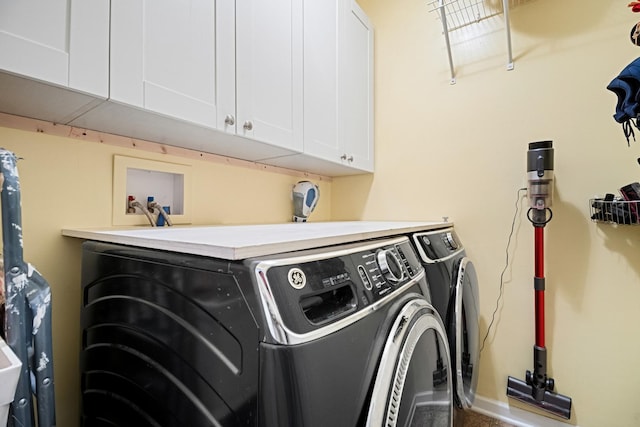 laundry area featuring cabinet space and independent washer and dryer