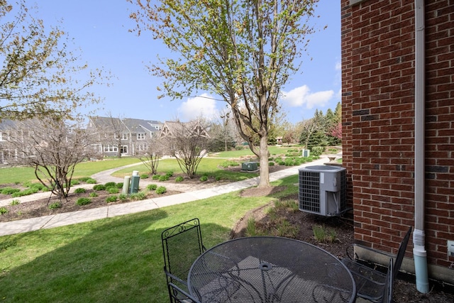 view of yard featuring central AC unit