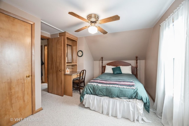 carpeted bedroom featuring ceiling fan and lofted ceiling