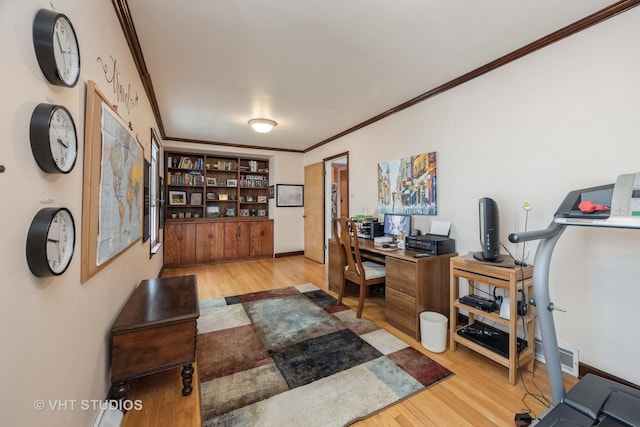 office with crown molding, baseboards, and wood finished floors