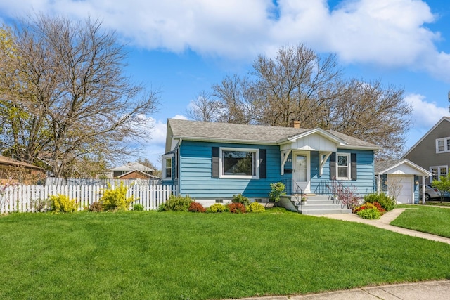 3448 Ann St, Lansing, IL 60438 - view of front of house featuring fence, a chimney, a shingled roof, and a front yard