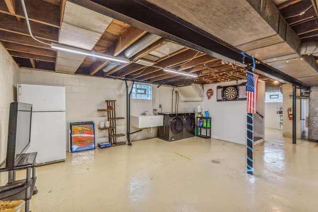 3448 Ann St, Lansing, IL 60438 - below grade area featuring a sink, freestanding refrigerator, and washer and dryer