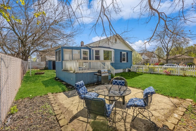 3448 Ann St, Lansing, IL 60438 - rear view of house with a fenced backyard, a patio area, a wooden deck, and a yard