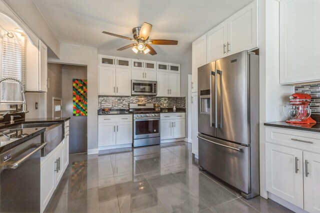 3448 Ann St, Lansing, IL 60438 - kitchen with ceiling fan, backsplash, dark countertops, and stainless steel appliances