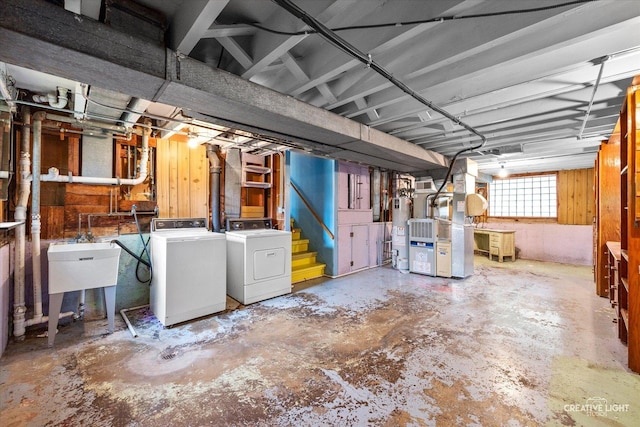 33 Chestnut Ave, Clarendon Hills, IL 60514 - below grade area with separate washer and dryer, water heater, heating unit, a sink, and stairs