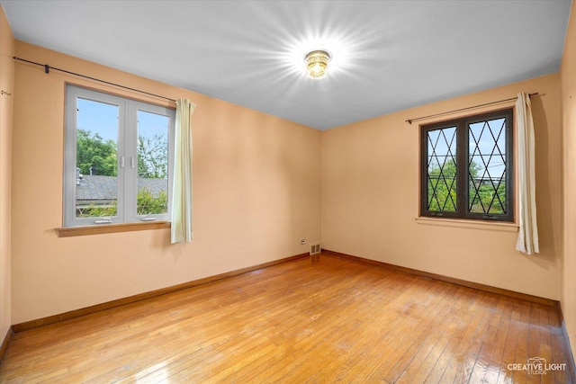 33 Chestnut Ave, Clarendon Hills, IL 60514 - spare room featuring healthy amount of natural light, light wood-style flooring, and baseboards