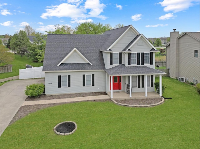 1309 Broad Creek Rd, Bloomington, IL 61704 - traditional-style house featuring fence, a shingled roof, central AC, a front lawn, and covered porch