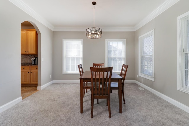 1309 Broad Creek Rd, Bloomington, IL 61704 - dining room featuring an inviting chandelier, ornamental molding, light carpet, and visible vents