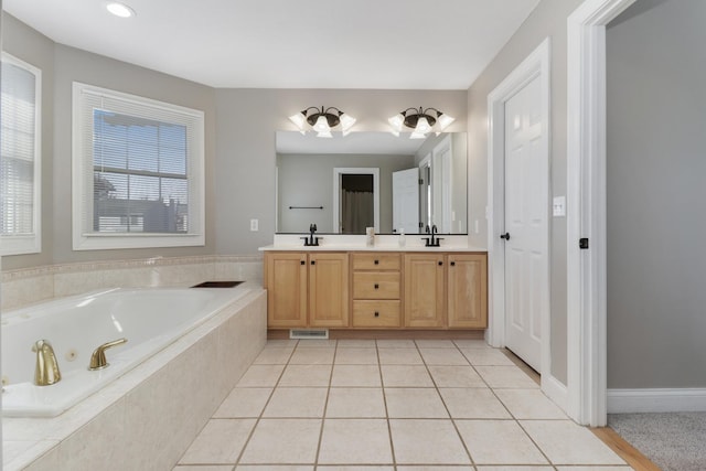 1309 Broad Creek Rd, Bloomington, IL 61704 - bathroom featuring visible vents, double vanity, a bath, tile patterned floors, and a sink