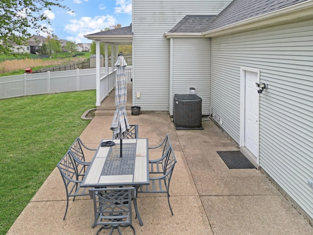 1309 Broad Creek Rd, Bloomington, IL 61704 - view of patio featuring fence, cooling unit, and outdoor dining area