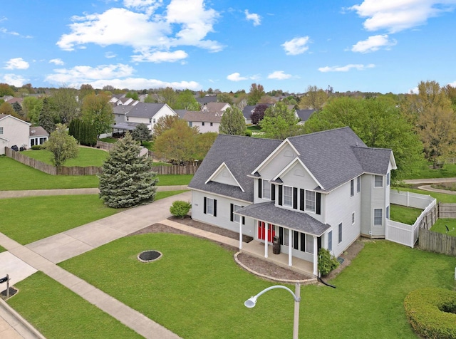 1309 Broad Creek Rd, Bloomington, IL 61704 - view of front of house with a shingled roof, a front lawn, fence, and driveway
