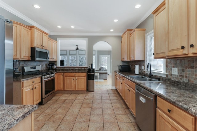 1309 Broad Creek Rd, Bloomington, IL 61704 - kitchen featuring light brown cabinetry, stainless steel appliances, decorative backsplash, and a sink
