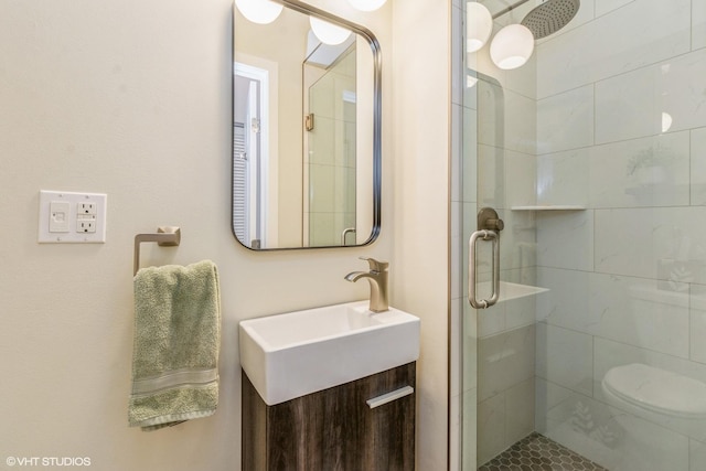 bathroom with vanity and a shower stall