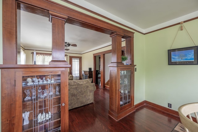 130 N Elm St, Leland, IL 60531 - living area featuring ornate columns, baseboards, crown molding, and wood finished floors
