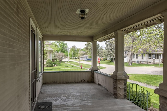 130 N Elm St, Leland, IL 60531 - wooden terrace with covered porch and a residential view