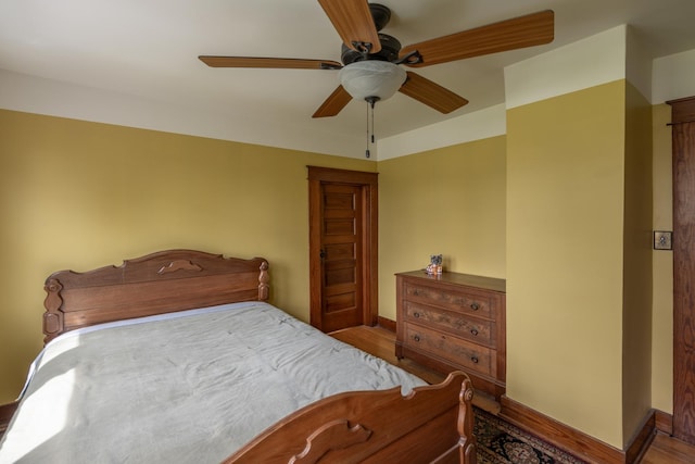 130 N Elm St, Leland, IL 60531 - bedroom featuring baseboards, ceiling fan, and wood finished floors