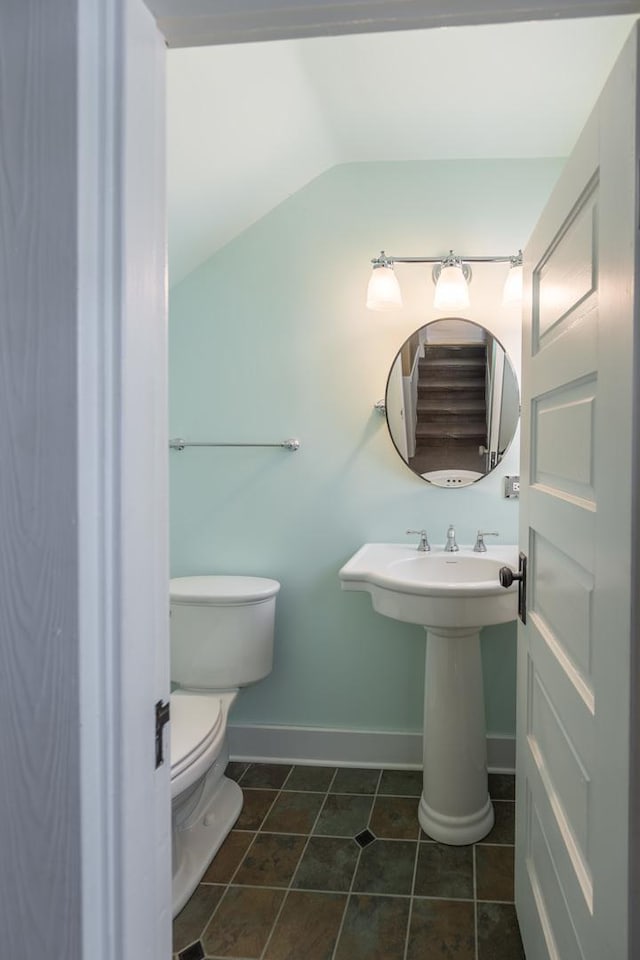 130 N Elm St, Leland, IL 60531 - bathroom with tile patterned flooring, baseboards, vaulted ceiling, and toilet