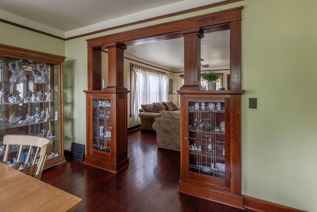 130 N Elm St, Leland, IL 60531 - interior space featuring ornamental molding, decorative columns, and wood finished floors
