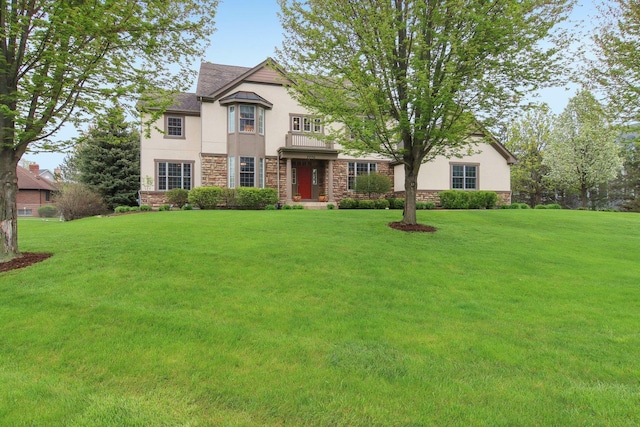 7770 Farrell Dr, Lakewood, IL 60014 - view of front facade featuring stucco siding, stone siding, and a front lawn