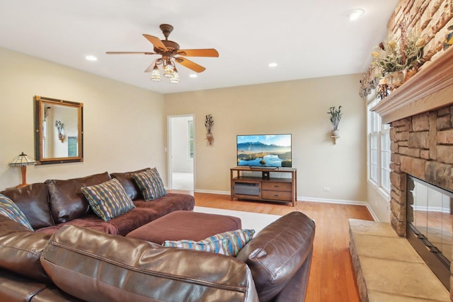 7770 Farrell Dr, Lakewood, IL 60014 - living area with light wood-type flooring, ceiling fan, recessed lighting, and a fireplace
